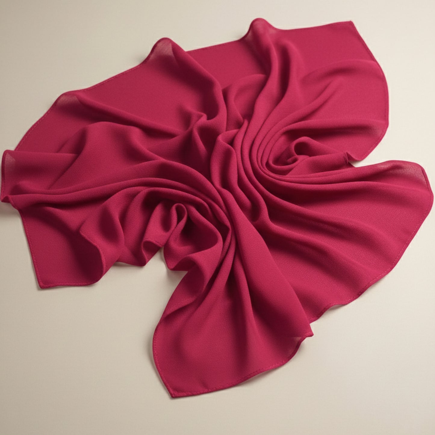 Crimson glow georgette hijab fabric laid flat showing lightweight airy folds
