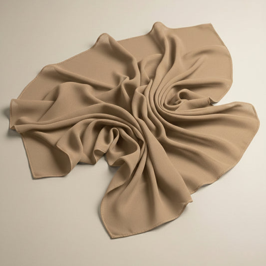 Dark beige georgette hijab fabric flat lay highlighting breathable folds