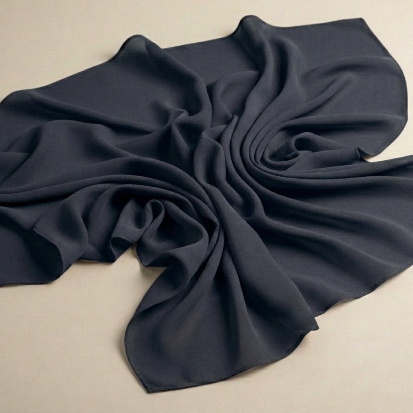 Charcoal grey georgette hijab fabric flat lay highlighting smooth drape