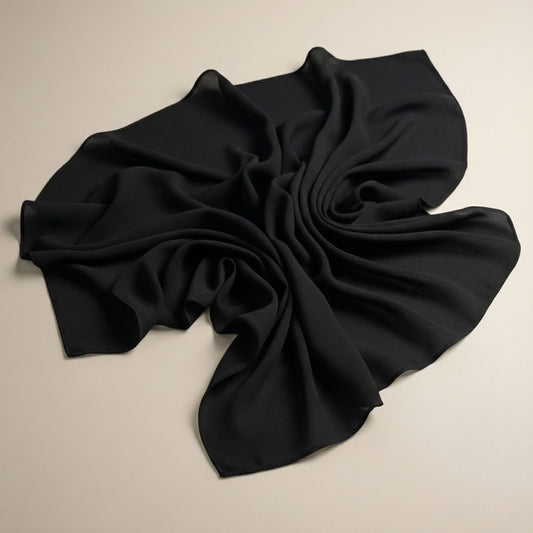Black Georgette Hijab flat lay, lightweight breathable fabric, soft texture, classic modest fashion essential
