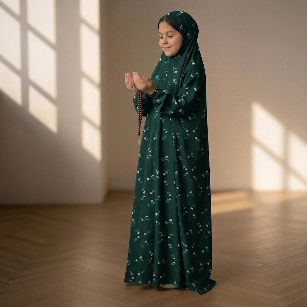 Young girl in a black and green flower namaz chaddar