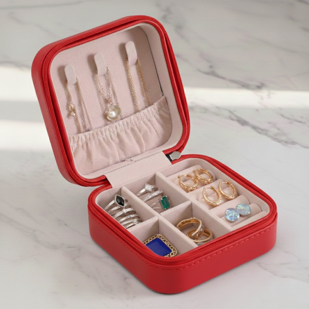 Red leather jewelry organizer box with zipper and organized compartments