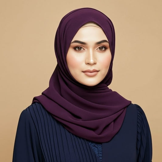 Woman wearing aubergine georgette hijab featuring deep purple tone and smooth drape