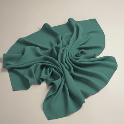 Spring green georgette hijab fabric laid flat showcasing airy texture