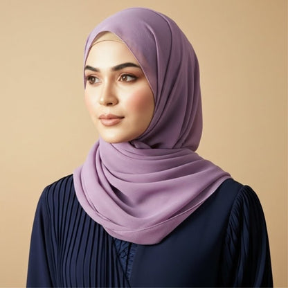 Model wearing lavender georgette hijab with gentle pastel tone and flowy drape