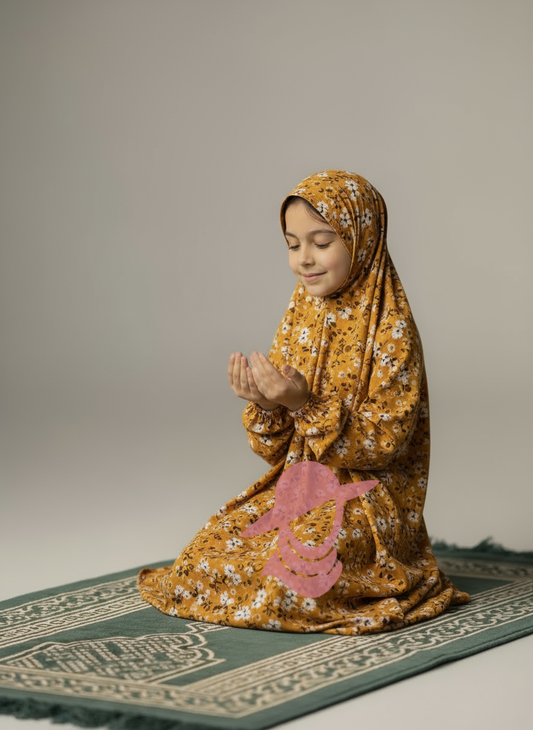 Mustard Leaves Kids Namaz Chaddar for girls, sitting on prayer mat, comfortable and colorful
