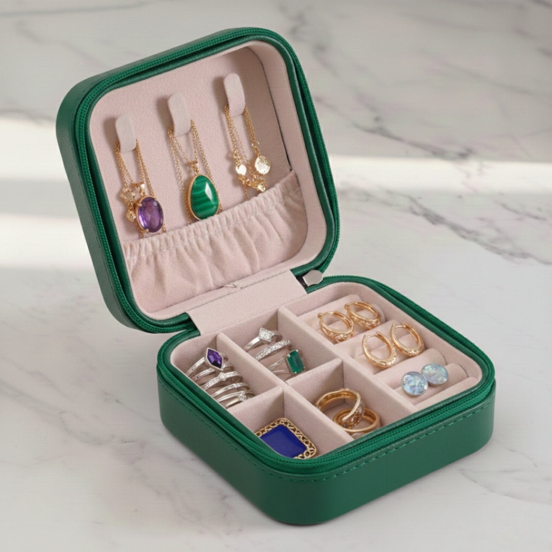Green leather jewelry organizer box with compact inner compartments
