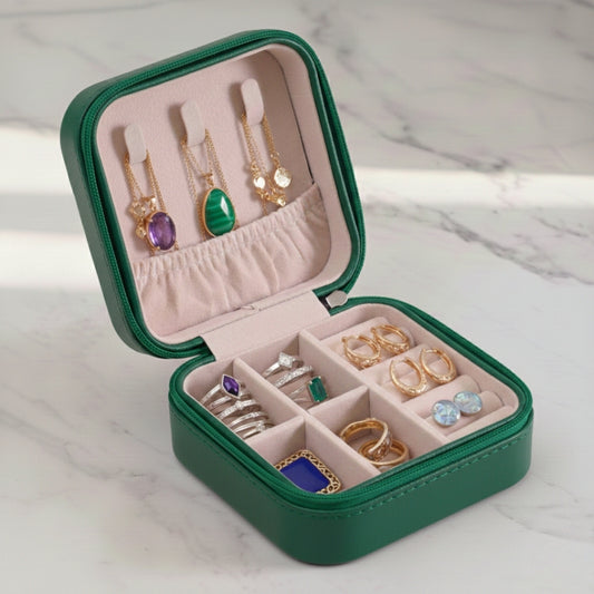 Green leather jewelry organizer box with compact inner compartments
