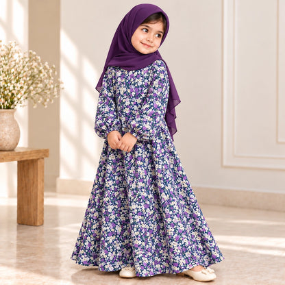 Girl wearing a flared abaya with purple, lilac and ivory flowers, elasticated cuffs and a plum-coloured hijab.