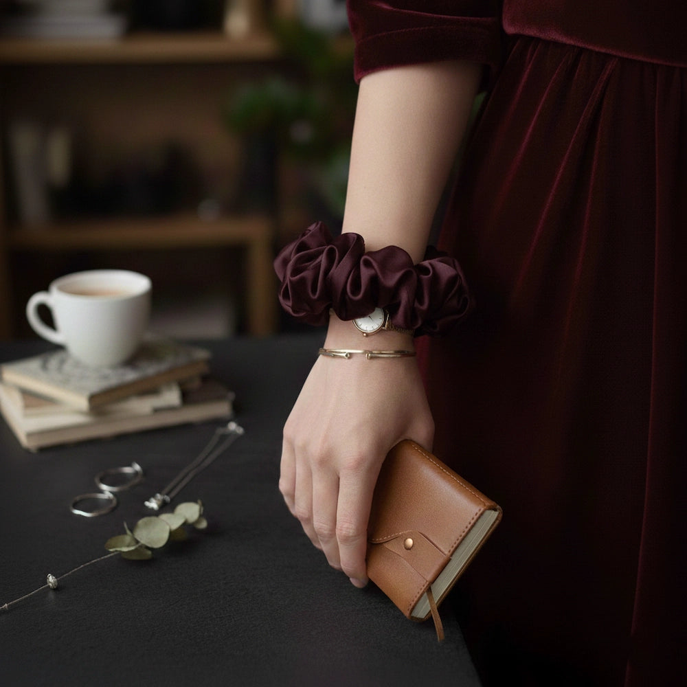 scrunchie worn on hair in plum color
