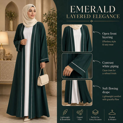 Woman wearing emerald green open front abaya with white piping and inner dress, modest 2 piece abaya set