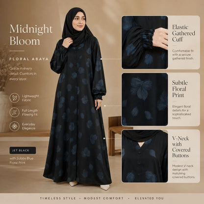 Woman wearing jet black floral abaya with subtle blue floral print, elastic cuffs and front buttons