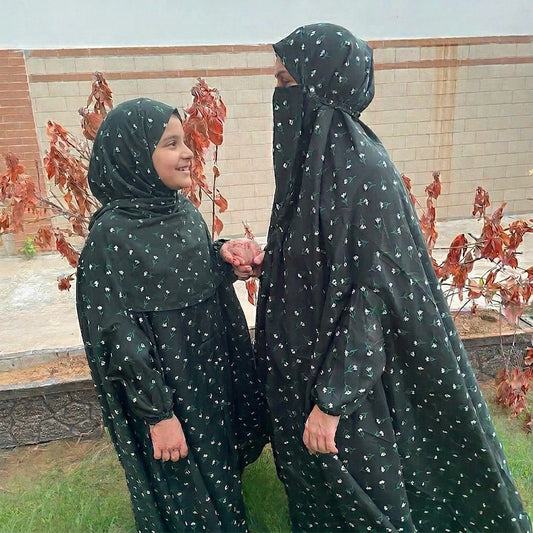 Mother daughter in same namaz chaddar in black and green flowers