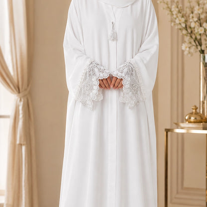 Pure white georgette abaya with hand embroidered pearl cuffs and hidden front button patti.  