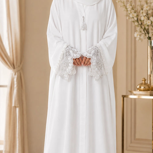 Pure white georgette abaya with hand embroidered pearl cuffs and hidden front button patti.  