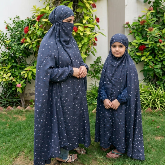 Mother daughter in matching blue namaz chaddar