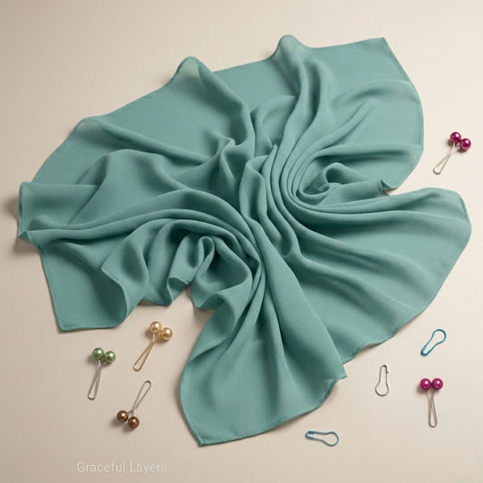 Ocean Mist georgette hijab flat lay in soft pastel green, lightweight modest hijab for women by Graceful Layers