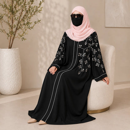 Black front open abaya with peach embroidery on sleeves front and matching embroidered hijab  