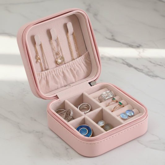 Pink leather jewelry organizer box with zipper and inner compartments
