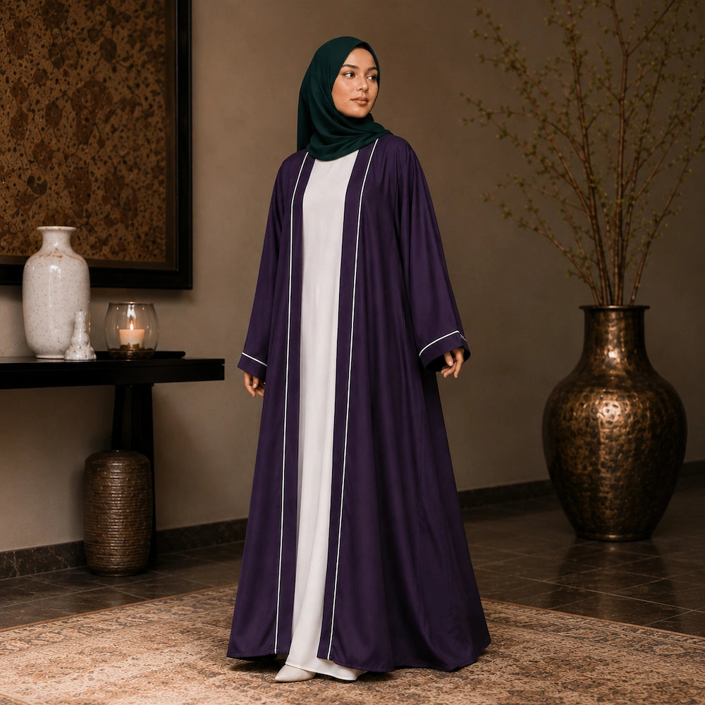 Woman wearing purple open front abaya with white piping and separate inner dress