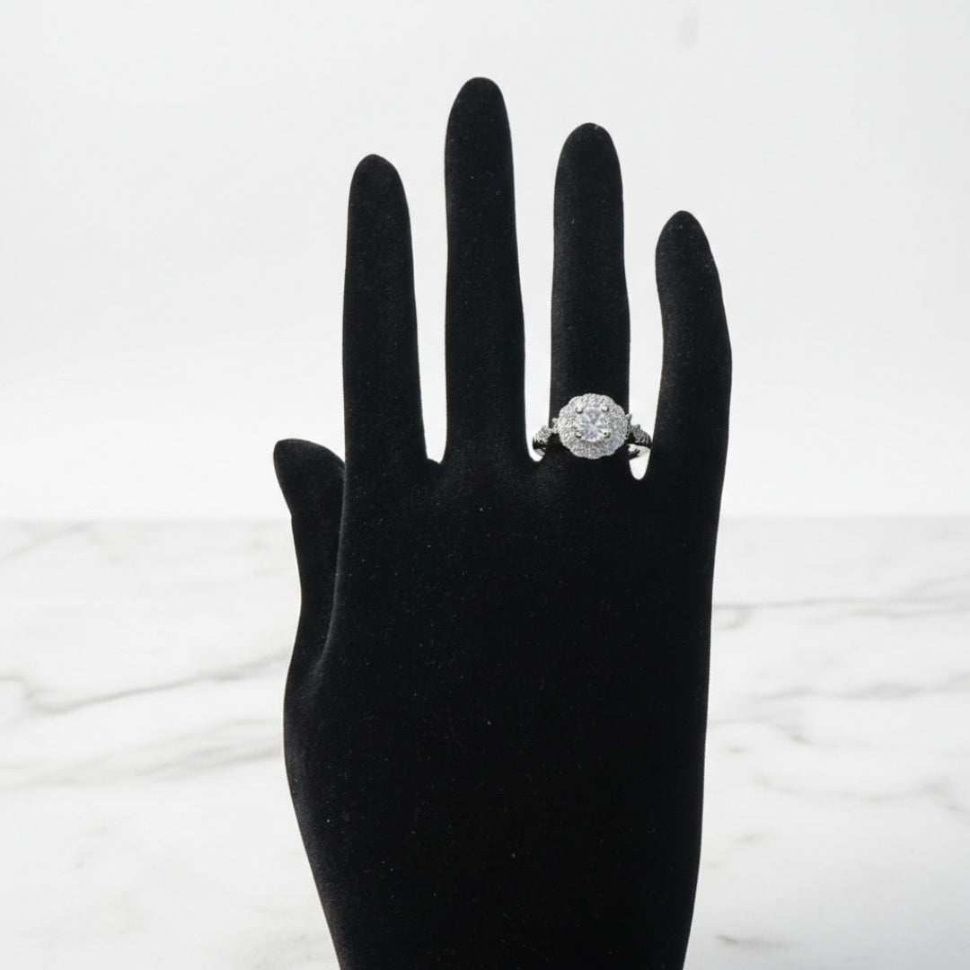 Classic halo zircon silver ring with circular center stone
