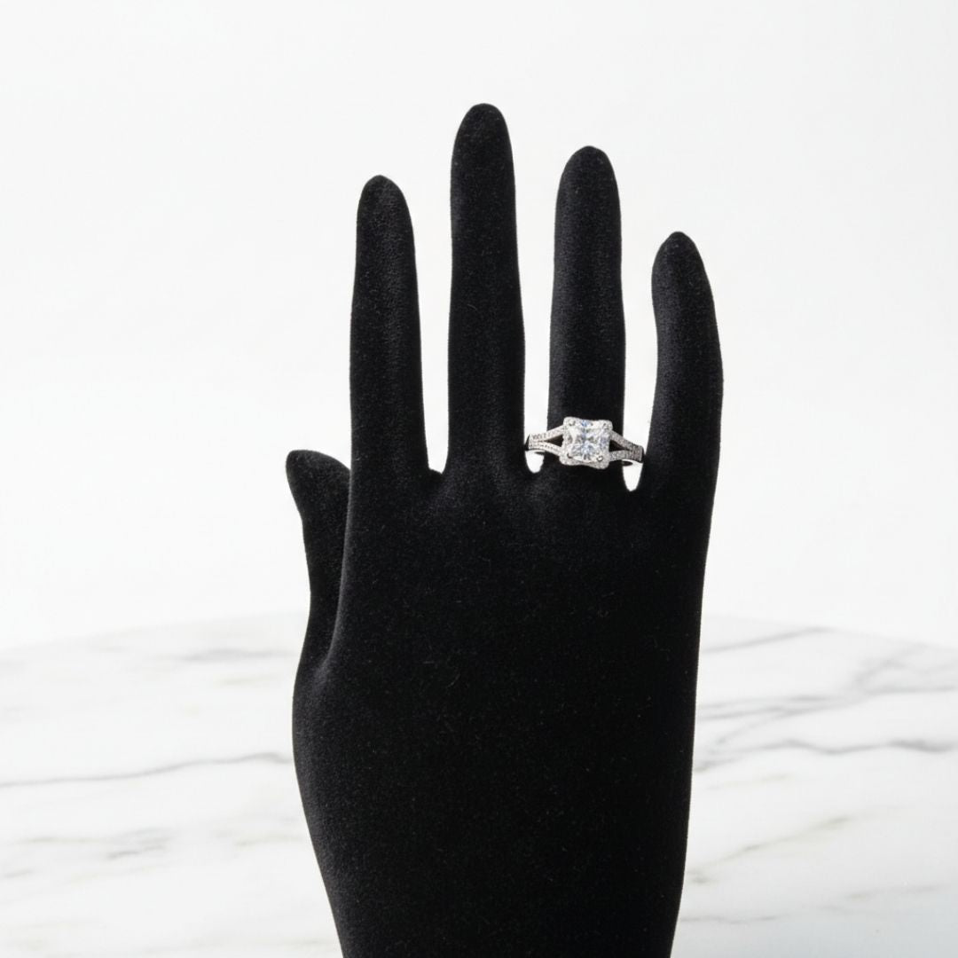 Silver princess cut halo zircon ring with split shank band and pavé stones
